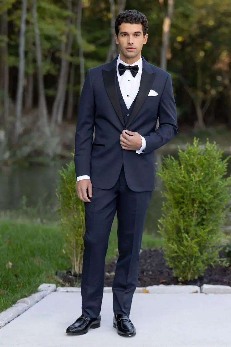 model is wearing a navy suit