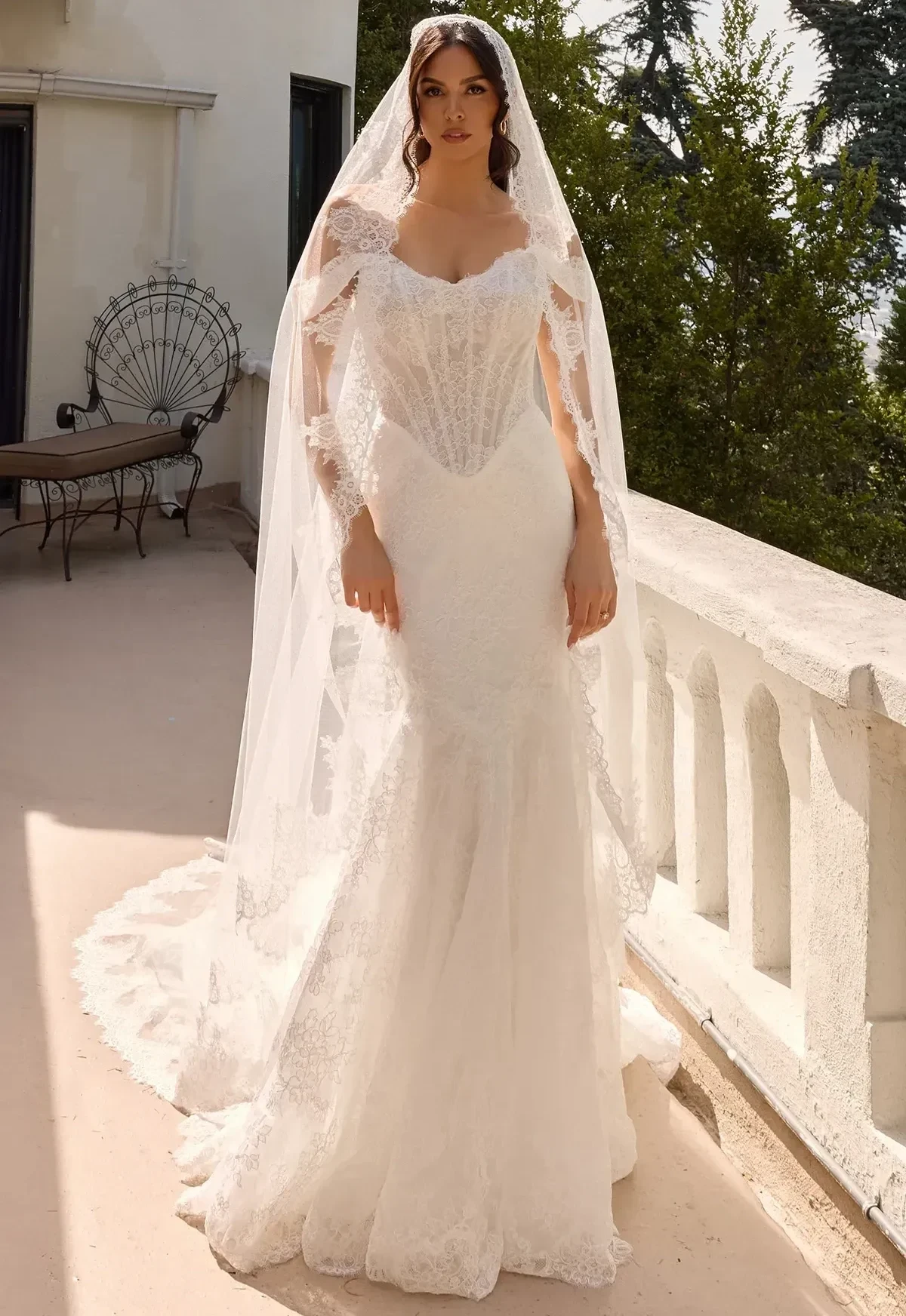 Model wearing a gown by essense of australia