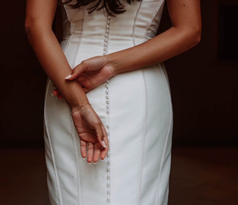 Model wearing a white dress