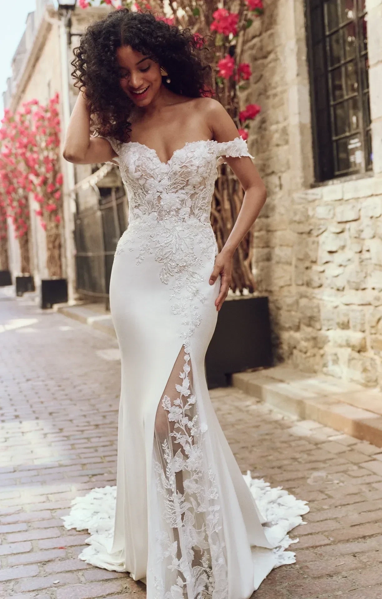 Model wearing a gown by Rebecca Ingram